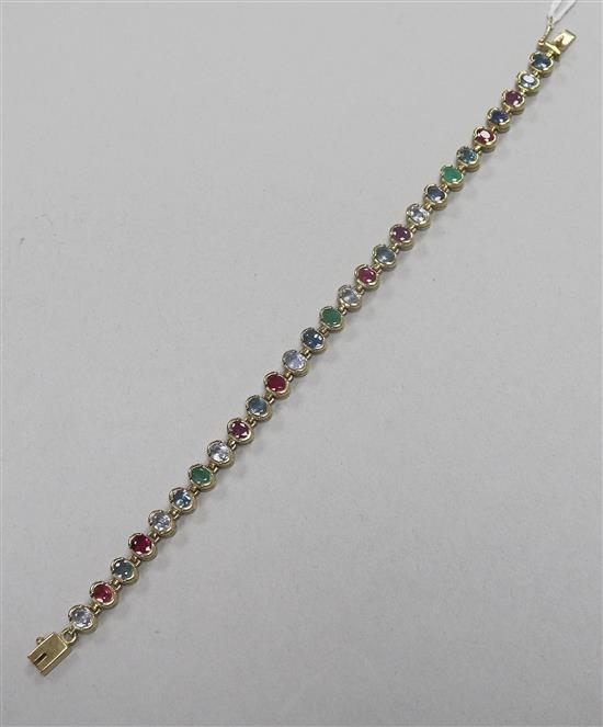 A 9ct gold and multi gem set line bracelet, 19.5cm.